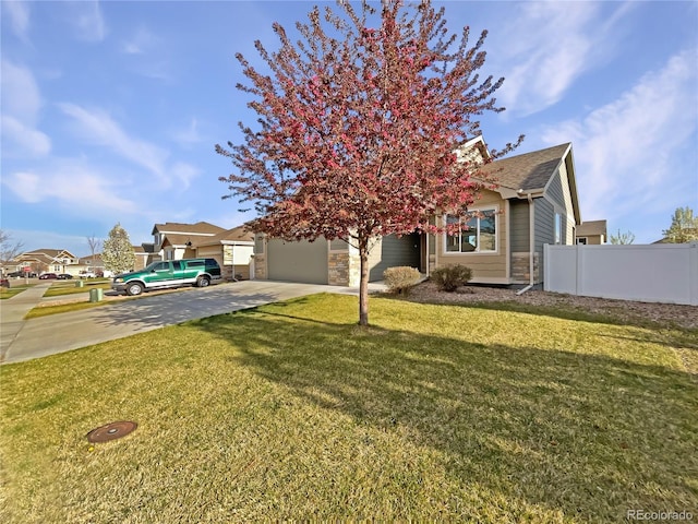 8612 13th St, Greeley, CO 80634 - view of property hidden behind natural elements with a chimney, fence, concrete driveway, a front yard, and a garage