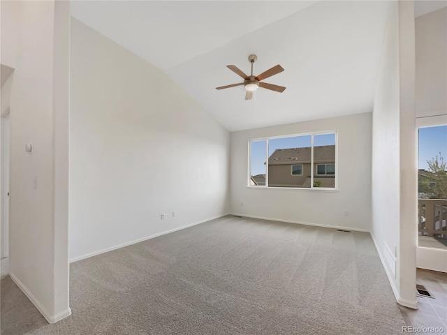 8612 13th St, Greeley, CO 80634 - carpeted spare room with vaulted ceiling, a ceiling fan, and baseboards