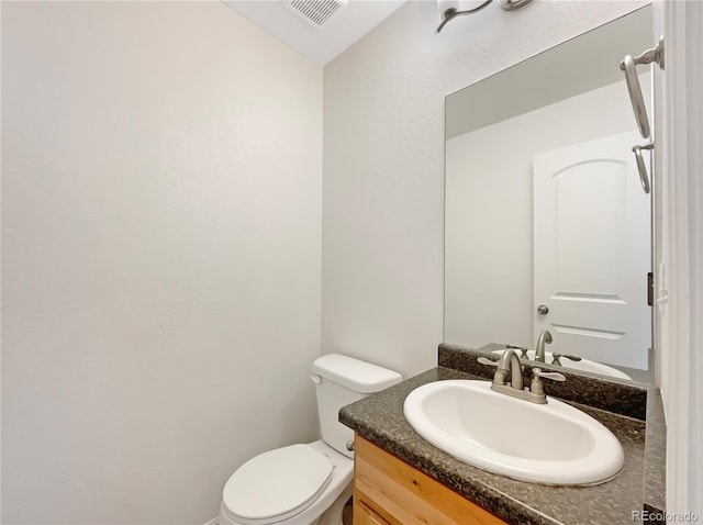 8612 13th St, Greeley, CO 80634 - bathroom featuring visible vents, toilet, and vanity