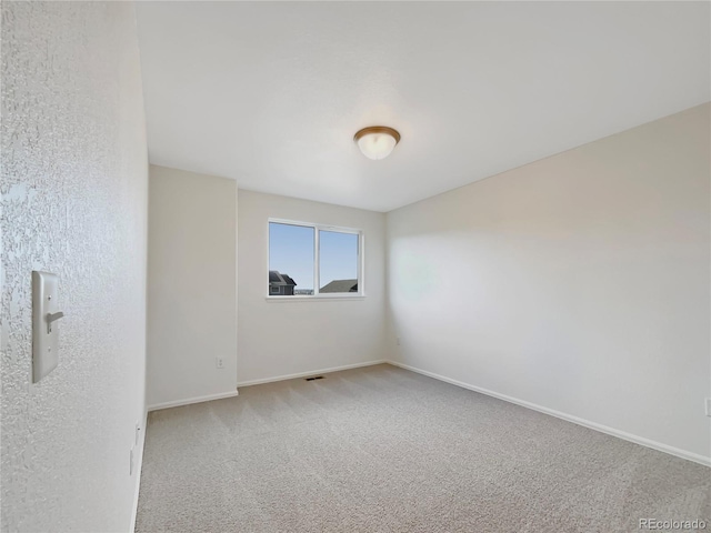 8612 13th St, Greeley, CO 80634 - spare room with baseboards, carpet flooring, and visible vents