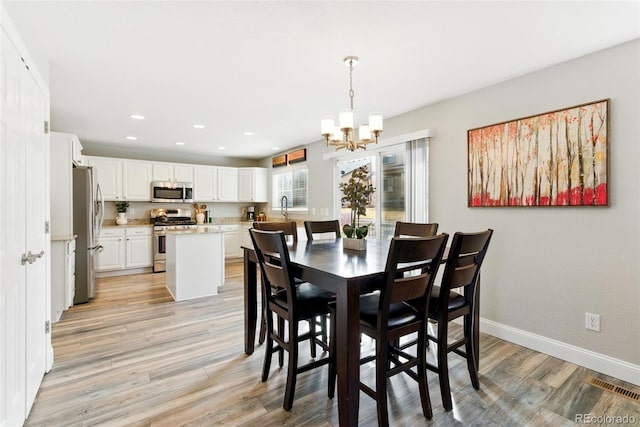 dining space featuring visible vents, recessed lighting, baseboards, and light wood-style floors