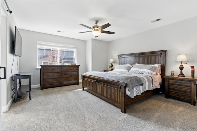 bedroom with visible vents, baseboards, a ceiling fan, and carpet flooring