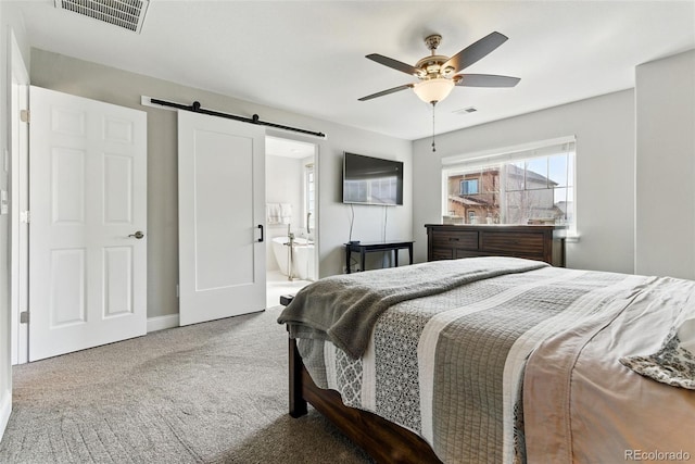 bedroom featuring visible vents, a barn door, carpet, and ceiling fan