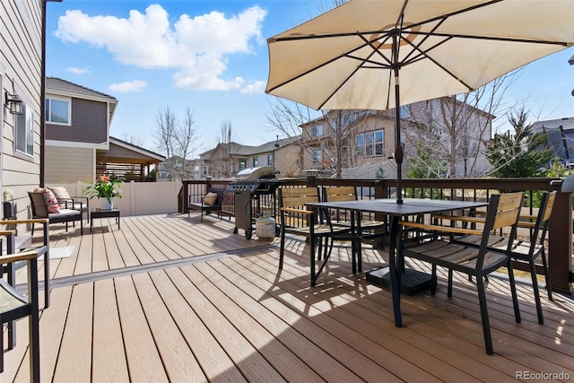 wooden terrace with outdoor dining area