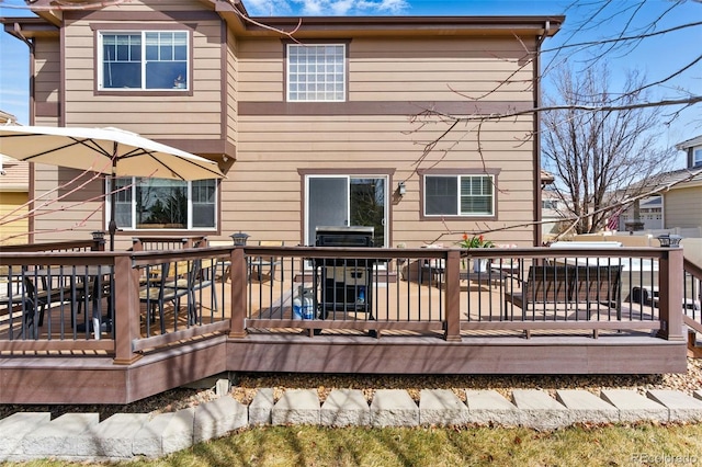 back of house with a wooden deck