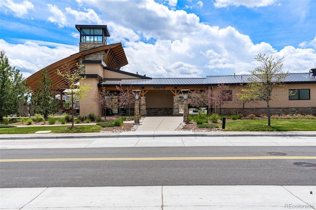 view of property with concrete driveway and a garage