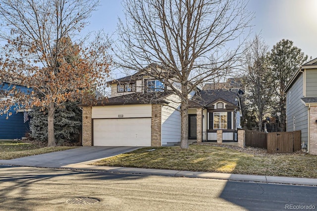 view of front of home featuring a garage and a front lawn