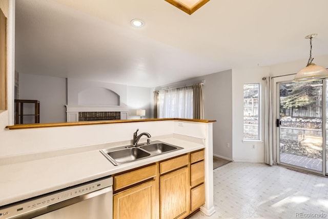 kitchen featuring sink, hanging light fixtures, and dishwasher