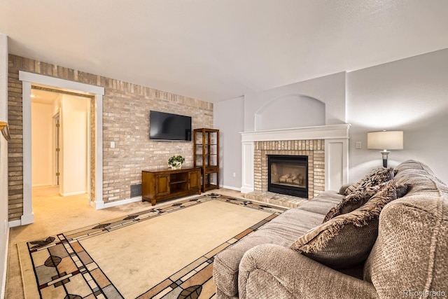 carpeted living room with a fireplace