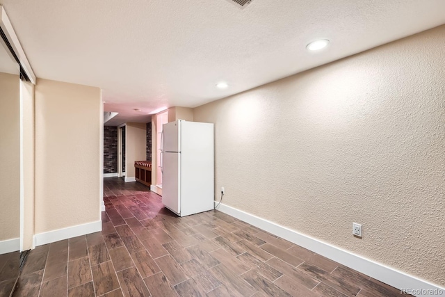 empty room featuring a textured ceiling