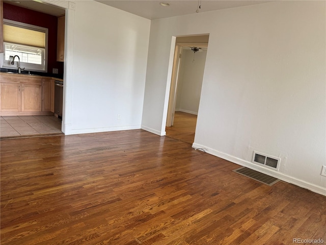 5618 Carr St, Arvada, CO 80002 - spare room with wood finished floors, baseboards, and a sink