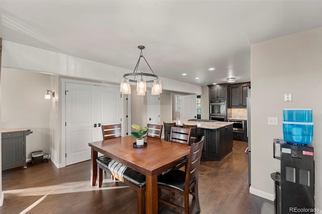 dining area featuring dark hardwood / wood-style floors