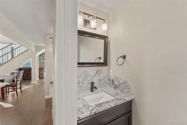 bathroom featuring hardwood / wood-style floors and vanity