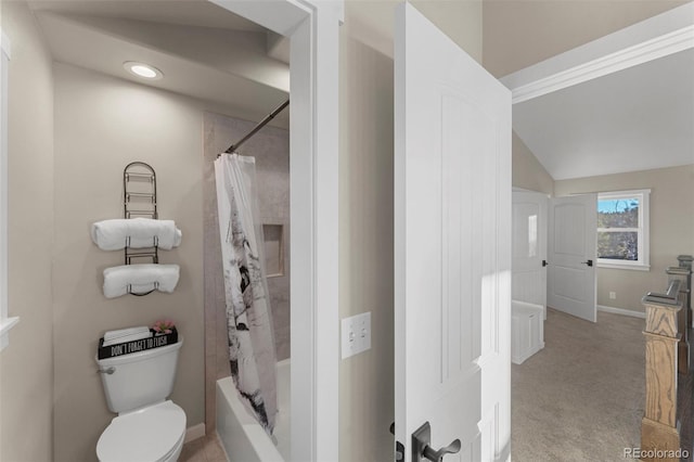 bathroom with shower / bath combination with curtain, toilet, and lofted ceiling