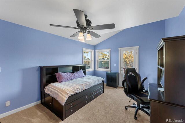 bedroom with ceiling fan, lofted ceiling, and light carpet