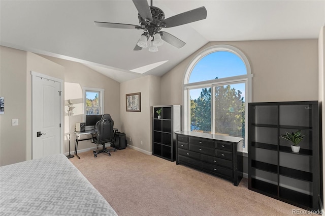 carpeted bedroom with ceiling fan and lofted ceiling