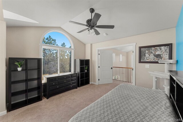 bedroom with ceiling fan, light carpet, and vaulted ceiling