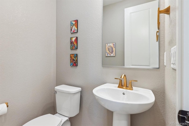 bathroom with a sink and toilet
