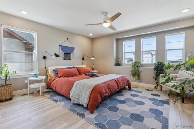 bedroom with recessed lighting, baseboards, and wood finished floors