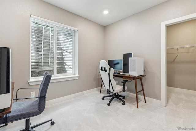 carpeted home office with baseboards