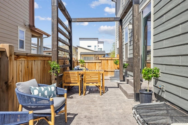 view of patio / terrace featuring fence