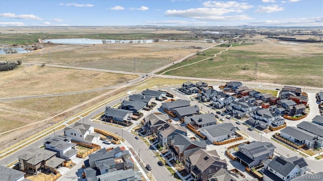 birds eye view of property featuring a residential view and a water view