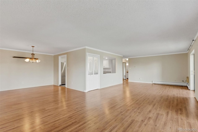unfurnished living room featuring baseboard heating, light wood-style flooring, crown molding, a chandelier, and a textured ceiling