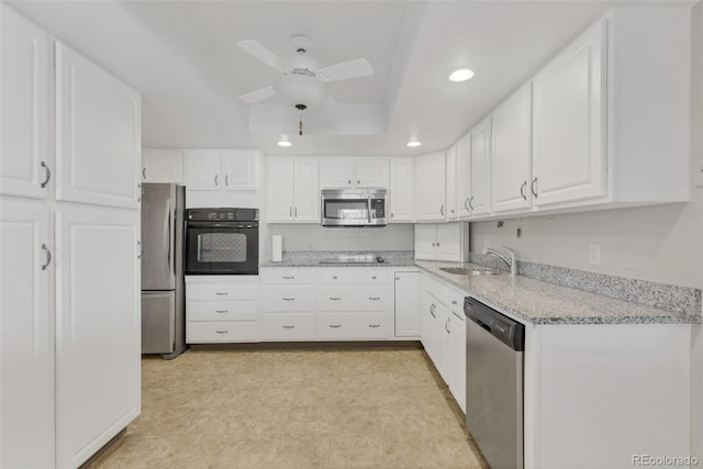 kitchen with black appliances, ceiling fan, recessed lighting, white cabinetry, and light stone countertops