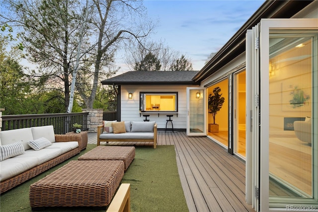 wooden terrace featuring outdoor lounge area