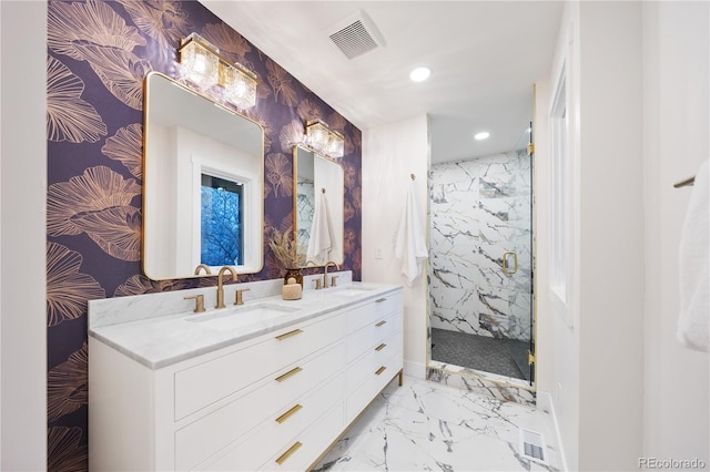 bathroom featuring a sink, marble finish floor, visible vents, and recessed lighting