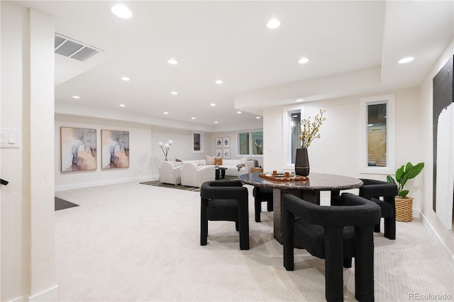 interior space featuring light carpet, baseboards, visible vents, and recessed lighting
