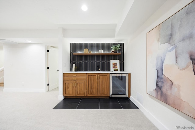 bar featuring recessed lighting, baseboards, a dry bar, and beverage cooler
