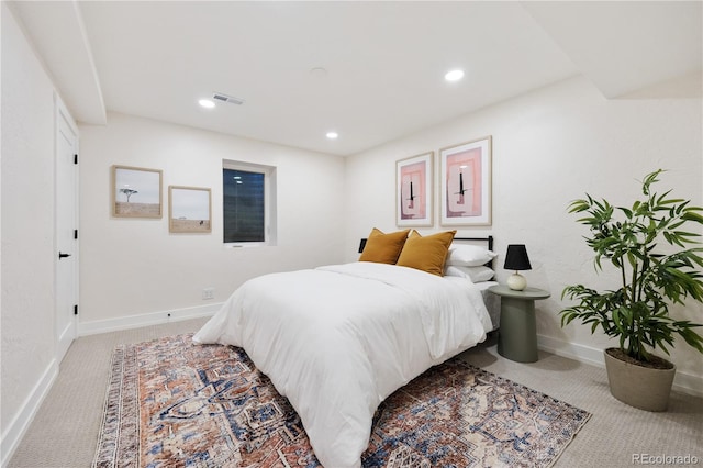 carpeted bedroom with visible vents, baseboards, and recessed lighting