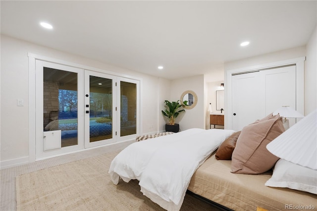 carpeted bedroom with connected bathroom, a closet, and recessed lighting