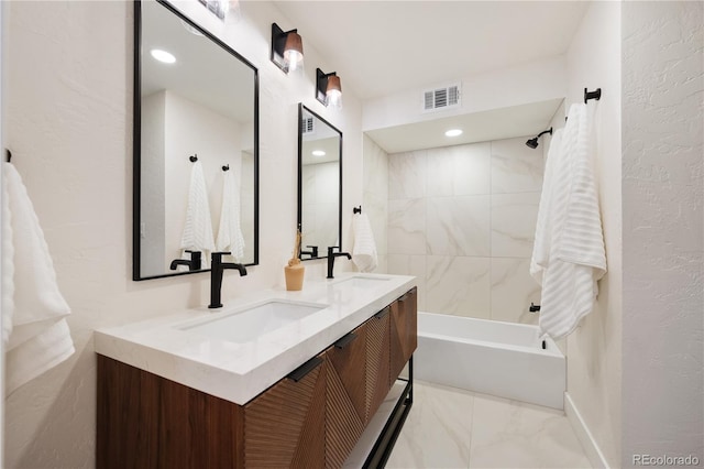 bathroom with a sink, double vanity,  shower combination, and visible vents