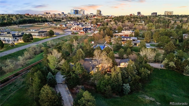 aerial view at dusk featuring a view of city