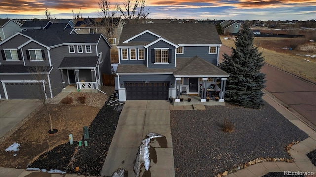 view of front of house with a garage and a porch