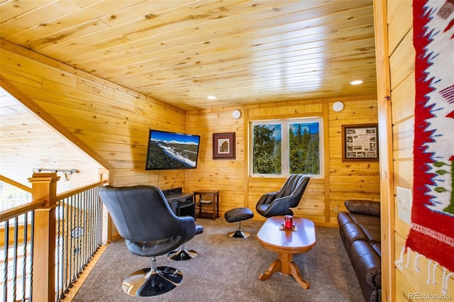 living area with carpet, wooden ceiling, and wood walls