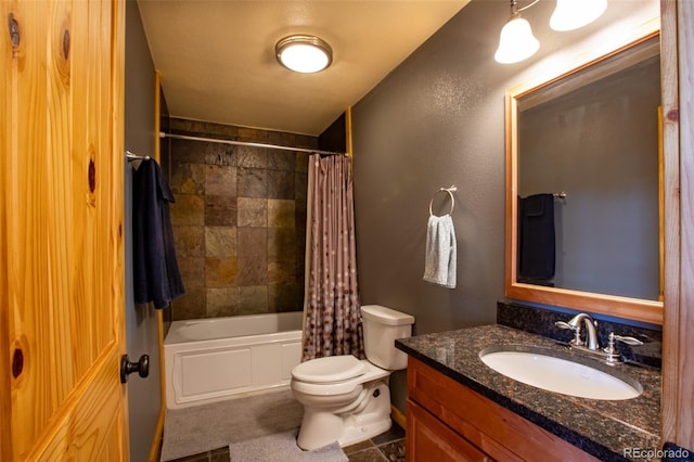 bathroom with a textured wall, vanity, toilet, and shower / tub combo with curtain