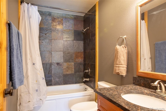 full bathroom featuring shower / tub combo with curtain, vanity, and toilet