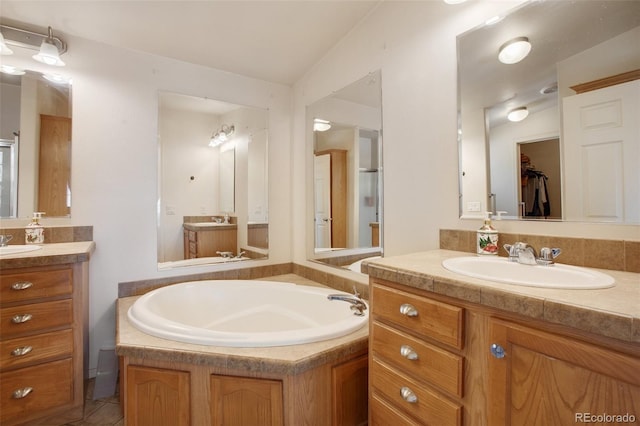 bathroom featuring two vanities and a sink