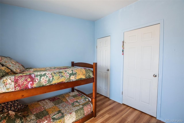 bedroom featuring wood finished floors