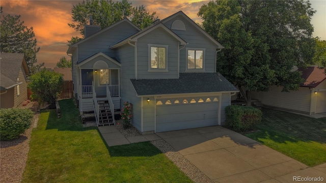 3755 Shefield Dr, Broomfield, CO 80020 - view of front of house featuring driveway, a garage, a chimney, and a front yard