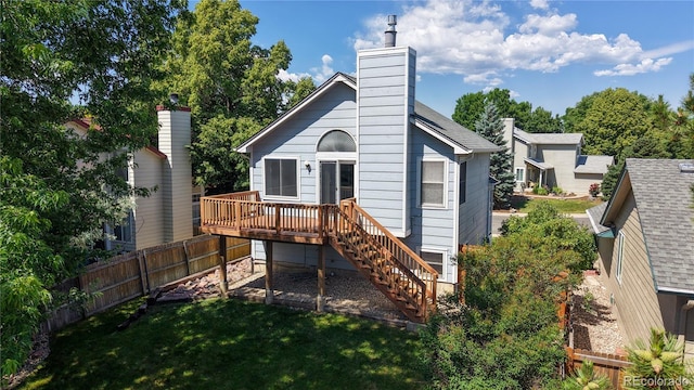 3755 Shefield Dr, Broomfield, CO 80020 - back of property featuring stairway, a deck, and a chimney