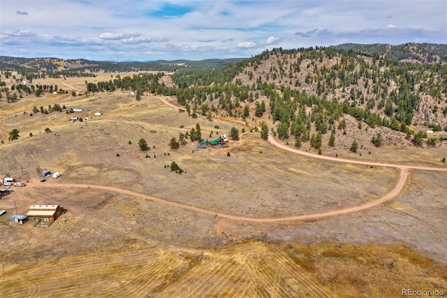 birds eye view of property with a rural view