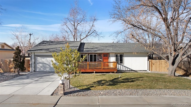 ranch-style home with a wooden deck, a front yard, and a garage