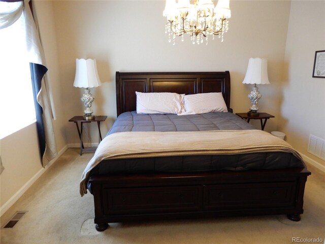 7354 Benton St, Arvada, CO 80003 - bedroom featuring light carpet, a chandelier, and baseboards