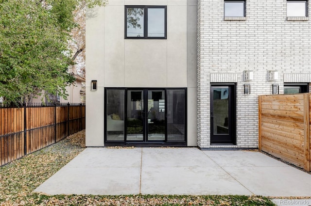 rear view of property featuring a patio area