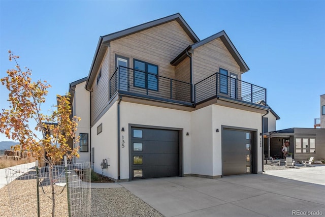 contemporary house with a balcony and a garage