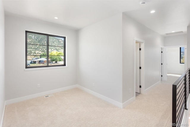 interior space featuring light colored carpet